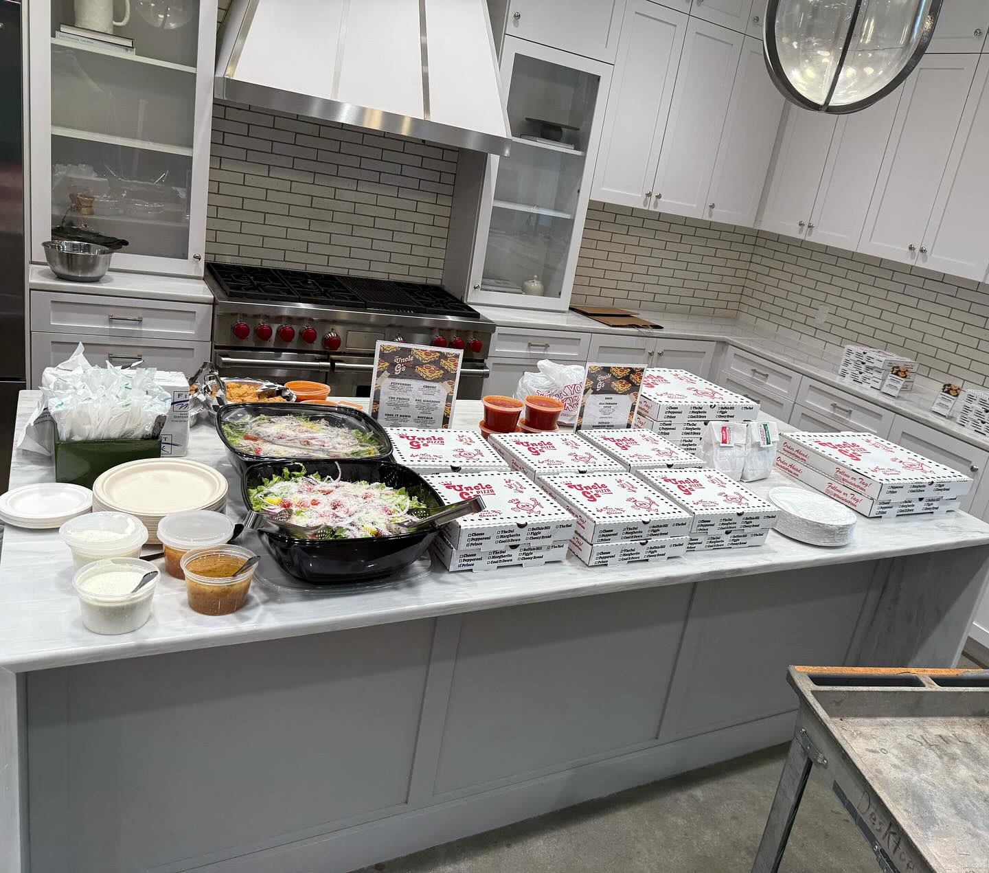 Rows of Uncle G's marinara cups prepared for service
