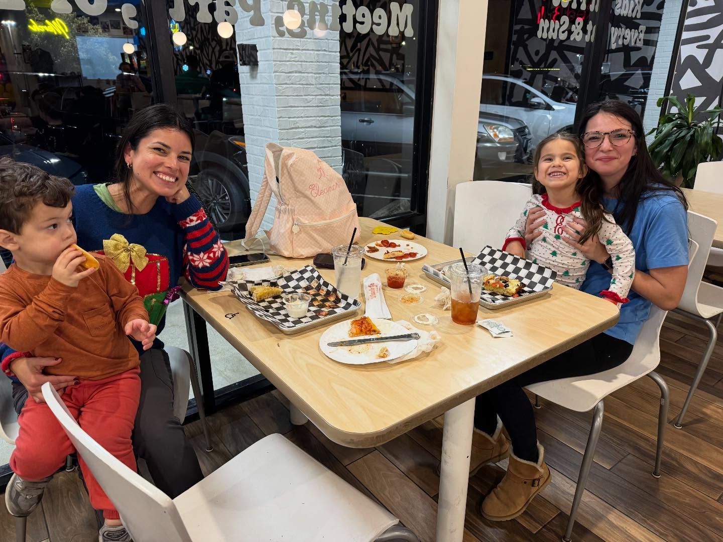 Families dining at Uncle G's Pizza